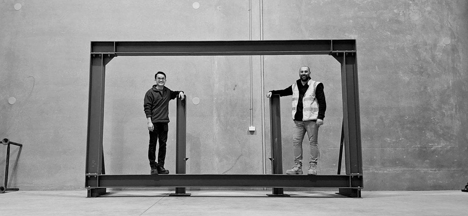 Applied Force Engineering founders with a purpose-built test frame